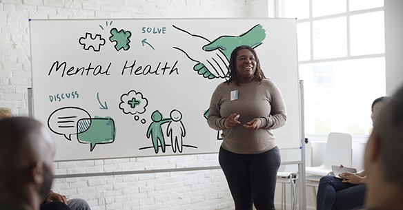 woman with whiteboard supervising first aid for mental health