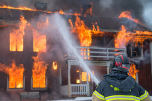 man fighting fire in safety gear