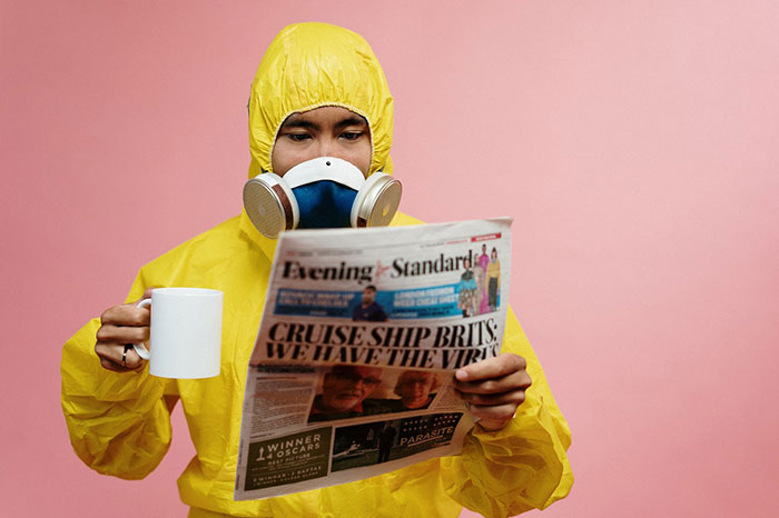 man in ppe with cup of tea coronavirus protection